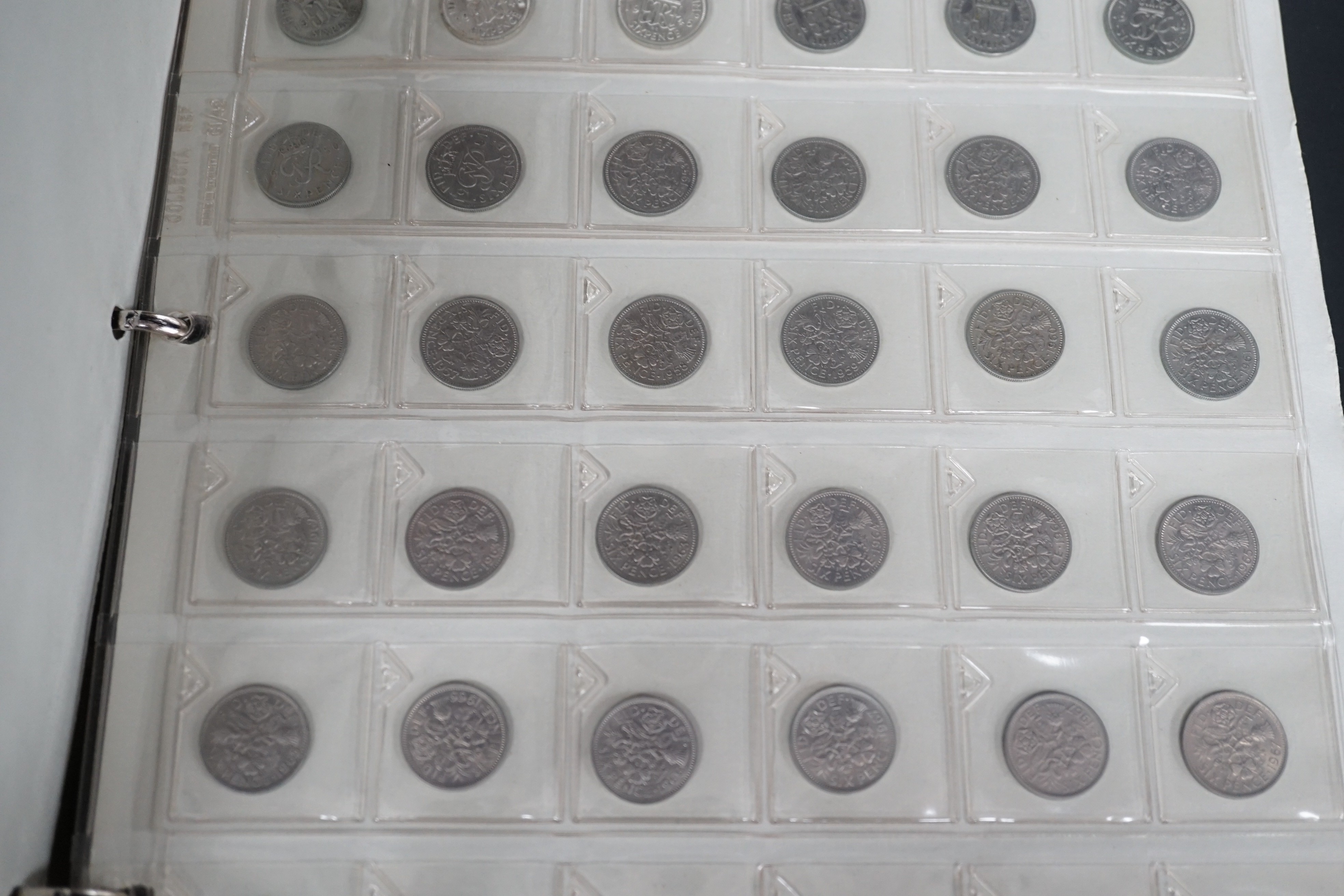 An album of British shillings, sixpences, groats, threepences and pennies, etc., George III to QEII including 1757 6d NVF, 1797 cartwheel twopence, etc.